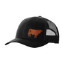 A black trucker-style cap with a black mesh back and a brown cow leather patch on the front panel, shown on a plain white background.