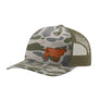 A trucker-style baseball cap with a green and gray camouflage pattern on the front panel and brim, olive green mesh back panels, and a brown cow leather patch on the front.