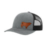 A gray trucker hat with black mesh back, and a brown leather cow patch on the front, shown against a plain white background.