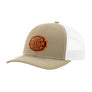 A tan trucker-style cap with a white mesh back and a brown 'your design here' leather patch on the front panel, shown on a plain white background.