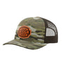 A camouflage trucker hat with a brown mesh back and a custom brown patch on the front that reads 'YOUR DESIGN HERE'.