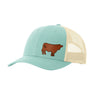 A teal blue trucker-style cap with a tan mesh back and a brown cow leather patch on the front panel, shown on a plain white background.