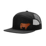 A black trucker hat with a flat brim, black mesh back, and a brown cow leather patch on the front panel, shown on a plain white background.