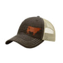 A dark brown trucker hat with a beige mesh back and a brown cow leather patch on the front panel, shown on a plain white background.