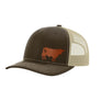 A trucker-style baseball cap with a dark brown front panel and brim, beige mesh back panels, and a brown cow leather patch on the front, shown on a plain white background.
