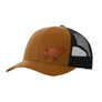 A warm brown trucker-style cap with a black mesh back and a brown cow leather patch on the front panel, shown on a plain white background.