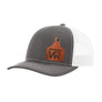 A gray trucker style hat with a white mesh back, and a leather cattle tag shaped patch engraved with "wr" on a white background