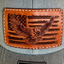 Gray cap with a leather patch featuring an eagle and American flag design.