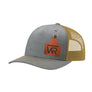 A gray trucker style hat with a gold mesh back, and a leather cattle tag shaped patch engraved with "wr" on a white background