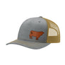A trucker-style baseball cap with a heather gray front panel and brim, gold mesh back panels, and a brown cow logo patch on the front.