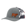 A heather gray trucker cap with a brown leather cow patch on the front and a navy, white, and red star-patterned mesh back.