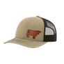 A beige trucker hat with a brown mesh back, a brown leather cow patch on the front panel, shown against a plain white background.