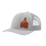 A light gray trucker style hat with a gray mesh back, and a leather cattle tag shaped patch engraved with "wr" on a white background