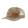 A tan camouflage trucker hat with a tan mesh back and a brown cow leather patch on the front, shown against a plain white background.