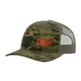 A camouflage trucker hat with a brown cow leather patch on the front panel and a green mesh back, shown on a plain white background.
