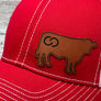 red baseball hat with leather cow shape patch